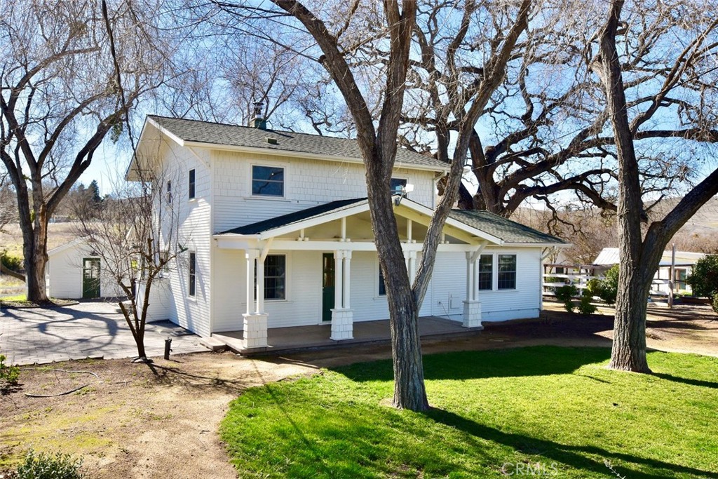 Celebrate a Century of Charm at this enchanting farmhouse in Templeton Wine Country! Nestled on nearly 5± acres w/pastoral vineyard views in the heart of Templeton AVA. This one-of-a-kind estate offers a blend of historical allure w/contemporary amenities. Each element curated to maintain rustic charm while providing modern conveniences to multiple renovated structures. Main home-3 BR/2 BA, & FR + extra room w/access to back deck; ideal for office, hobbies, exercise, pets, etc. or use to convert FR to a downstairs master suite. LR showcases a unique fireplace & oven combo. Bench seating positioned ideally at corner windows, creating cozy dining nook. Chef’s kitchen equipped w/six-burner vintage look stove & pot filler + hanging storage for pots & pans, upgraded cabinetry w/soft-close drawers, retro style refrigerator & double farm sink. Oversized butler’s pantry w/extensive cabinetry, countertops & large walk-in food storage, complete w/scenic view window above work station. French doors in formal dining room open to deck, offering exquisite outdoor dining experience. FR includes extensive cabinetry & shelving. Upstairs, the residence houses 3 bedrooms & spacious bathroom featuring large shower, separate vessel tub & dual vessel sinks. Large courtyard w/built-in BBQ pit, outdoor sink & ambient lighting ideal for large gatherings separates main home from guest house w/kitchenette & ¾ bath. Private patio overlooks seasonal creek that runs through the land. Create immediate rental income leasing it out. Previously licensed as a vacation rental. Dutch door opens to freestanding laundry hut doubles as spacious hobby or sewing room. New water filtration system & solar fully owned. 1,300± sq. ft. workshop w/220 power + attached garage for extra vehicles or farm equipment. Outdoor living is a highlight featuring easy care dip pool w/redwood decking. Raised garden beds, & multiple yards shaded by majestic oaks & many other mature trees, shrubs & flowers. Flagstone patio w/hanging lights, fire pit & covered front porch provide multiple venues for relaxation. Charming hen house w/coop near fenced garden area w/additional raised garden beds. Set up a farm stand at the road to sell eggs and veggies! Upscale shed w/tall ceilings nearby for supplies & extra storage. Equestrian area can be accessed by separate gate at side road & includes hay barn + space for arena. Area also suitable for vineyards or other ventures. Property fully fenced w/gates & circular driveway