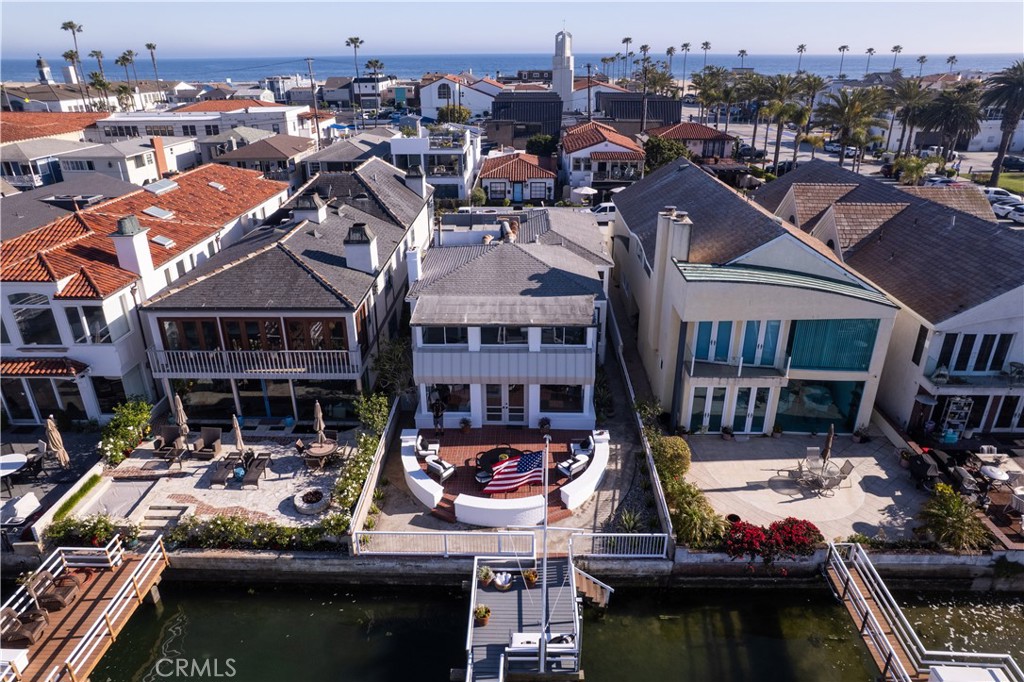 Functional floorplan. Boat dock for multiple boats. Views of Newport Bay Channel, Christmas Boat Parade. and Lido Island. One ground floor bedroom and three bedrooms upstairs. Primary suite has views of the bay. Room for elevator if needed. Ready to move in. West Bay Avenue is a highly coveted location. Short walk to the beach. Two car garage. Owners are the real estate agents.