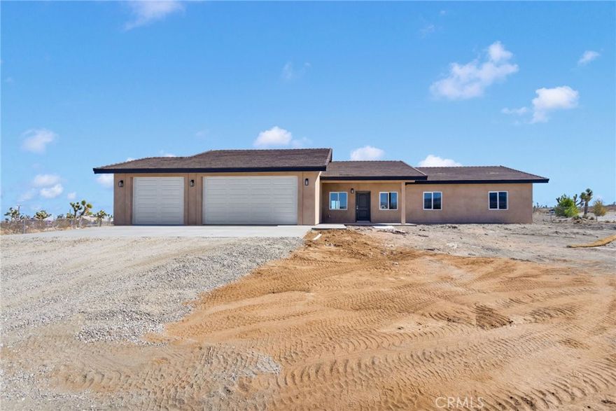 Welcome to your modern desert retreat in Piñon Hills! This brand-new 4-bedroom, 3-bath home offers 2,100 sq. ft. of thoughtfully designed living space on a fully fenced 1.87-acre lot. Ideally located on Rosado Road—less than 300 feet from the paved Duncan Road—this property provides excellent accessibility while maintaining the peaceful, rural charm Piñon Hills is known for.



Step inside to an open-concept layout showcasing beautiful modern color choices and contrasting dark trim for a clean, contemporary look. The interior features luxury vinyl plank flooring in the main living areas and plush carpeting in the bedrooms and walk-in closets. The chef’s kitchen highlights sleek gray cabinetry, custom quartz countertops, and soft-close drawers, carried seamlessly through the bathrooms, laundry room, and hallway. The primary suite includes a spa-inspired bathroom with a custom-tiled shower and a walk-in closet complete with built-in shelving and a shoe rack.



Energy-efficient upgrades include dual-pane windows and sliding doors, a 5-ton HVAC system, solar panels, full Title 24 compliance, and radiant barrier roof insulation for year-round comfort. Stylish farm-style doors and the modern palette throughout add a timeless designer touch.



Additional highlights include an oversized 3-car garage with extra depth, a dedicated laundry room, a covered front porch, and ample space for RV parking, horses, or a future workshop—offering the flexibility to enjoy true desert living.



Located just minutes from Highway 138 and Phelan’s Snowline School District, this property combines quiet country living with convenient access to local shopping, dining, and Wrightwood’s mountain recreation. Don’t miss this exceptional new build in one of the High Desert’s most desirable areas!