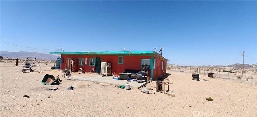 Fixer-upper with amazing mountain views, perfect for anyone looking for a project, a weekend warrior getaway, or a property to make their own. Located on a city-maintained road, this property had a new septic system and leach lines installed just two years ago, has power on site, and water is hauled, has a functional water tank that includes a pump replaced less than a year ago. Featuring three bedrooms and three bathrooms (tax records show two bedrooms and one bathroom—buyer to verify permits and property details), this is a great opportunity to add your personal touch and design your own desert escape. Property is being sold as-is, offering plenty of potential to create a relaxing retreat away from the city or a place to call home.