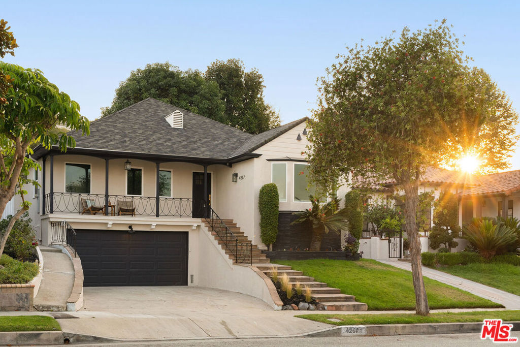 In the heart of historic View Park, a story of stunning transformation has unfolded, reimagining this classic residence into a haven of quiet luxury where every modern amenity whispers the promise of a beautiful new beginning. Envision a new chapter of your life unfolding in this 3bed/3bath residence where timeless allure couples with modern function. Every corner has been thoughtfully transformed with meticulous care, creating an open-concept sanctuary with distinctive spaces designed for a life of effortless enjoyment. As you cross the threshold into the foyer, brand-new engineered hardwood floors guide you through a sun-drenched, spacious living room graced by an original fireplace framed with new sconces and a bay window with sweeping city views. Imagine sipping your morning brew here, taking in the sunrise while enjoying your favorite new read. The custom-designed kitchen is a culinary dream, with Caesarstone countertops and backsplash, custom cabinetry with soft-close drawers, and top-of-the-line stainless steel appliances. A new standard has been set with a dedicated microwave niche, island with built-in seating and cozy seating nook nearby with built-in storage. The formal dining area has room for a large table perfect for hosting intimate gatherings. Leave the french doors ajar and let friends + family bask in the joys of the breeze and views of the verdant yard space. Two primary bedroom suites offer spa-like retreats, both enjoying custom-built closets and full baths with soaking tubs. The guest primary features a private office, perfect for visiting guests to hide away when work calls. The main suite is a true place of refuge enjoying its own private wing and direct private access to an attached outdoor patio. Enjoy the peace and solitude of a fully fenced yard, sure to be your new oasis with multiple spaces to enjoy and a fireplace to warm by. Spend evenings al fresco indulging in a glass of wine on the newly landscaped grounds surrounded by fruiting lemon trees and mature ficus hedges. Upgraded electrical, new copper piping, and a tankless water heater ensure peace of mind, and the finished 2-car garage with an EV charger outlet adds modern convenience. From the expansive attic with potential for additional storage or even potentially conversion to future living space, to the newly updated basement with even more storage, to the new central HVAC system and Milgard energy-efficient windows ensuring year-round comfort, every detail has been considered. As the sun sets, a breathtaking panorama of the downtown LA skyline and the city views unfolds before you, a daily reminder of the vibrant life that awaits just moments away. This isn't just a house; it's the beginning of a beautiful love story, a place to create memories and live your dreams in one of LA's most coveted neighborhoods. Welcome home!