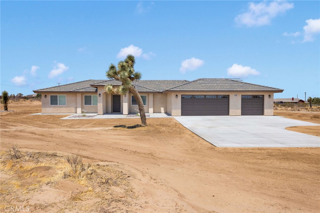 BRAND NEW CONSTRUCTION!! LOCATED ON 2.5 ACRES OF LAND WITH BEAUTIFUL MOUNTAIN VIEWS! Paid solar, (7 panel). Four bedroom and two bath home. Open floorplan. Large Great room. Stunning kitchen with quartz counters, island and stainless steel appliances. Split floorplan. Large bedrooms. Master bath with separate tub and shower. Walk-in closet in master bedroom. Beautiful wood-look flooring. Full window coverings. Laundry room with sink and storage. Bathrooms with quartz counters and beautiful cabinetry. Covered patio. Beautifully landscaped front yard. RV parking. Three-car garage. Plenty of room for your toys and horses. Just minutes to the I-15 freeway. Great for commuters. Located in popular Snowline School District. Rural living at it's best but close enough to all the amenities such as restaurants and shopping. Short drive to local mountain resorts.