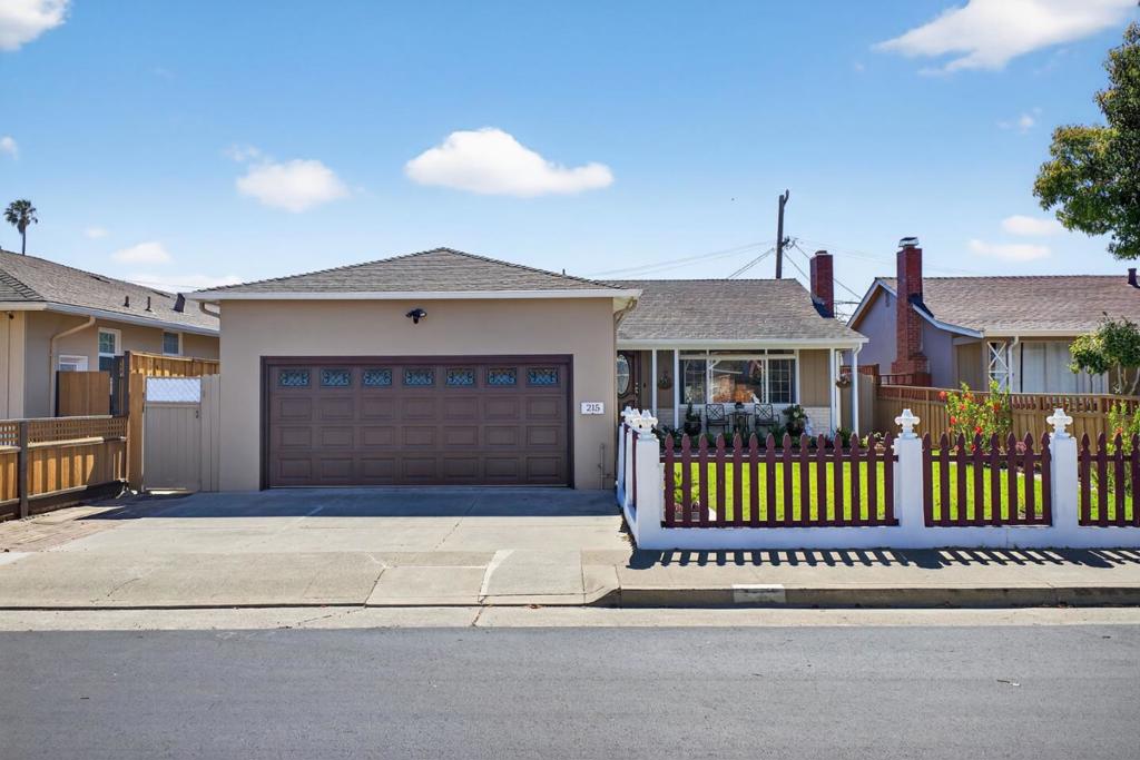 Located in the sought-after North Shore neighborhood of San Mateo, this charming single-family home blends comfort, style, and the relaxed elegance of California living. A landscaped front yard and inviting porch offer great curb appeal and a warm welcome to visitors. Inside, the bright living room is filled with natural light and features a classic brick fireplace, perfect for cozy evenings. The updated kitchen and dining area are thoughtfully designed with quartz countertops, stainless steel appliances, ample cabinetry, and a stylish barn door that adds character. Three spacious bedrooms and one full bath provide comfortable accommodations with layouts that balance privacy and ease. Step out back to a generous yard with a relaxing deck, shaded pergola, and lush lawnideal for barbecues, al fresco dining, or quiet afternoons in the sun. An attached two-car garage includes secure parking, extra storage, and a convenient half bathroom. Just blocks from Coyote Point Park, Poplar Creek Golf Course, and the bayfrontperfect for peaceful walks and bike rides. Close to freeways for easy commuting, shopping and downtown San Mateo, parks, top-rated schools, and dining, 215 Prague Street offers the ideal blend of tranquility and accessibilitymaking it the perfect place to call home.