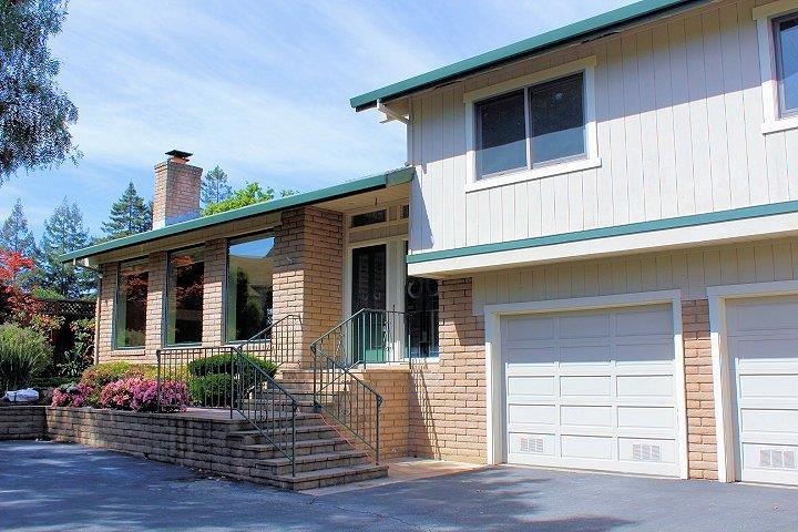 Private Setting! Perched overlooking Mt. Carmel neighborhood. Super floor plan with 3 BRs and a den on main level. Separate office on garage level for those techies, or great opportunity for a full in-law with full bath down. Master bedroom suite with own bath a monster walk-in closet. Updated for the fussiest buyer, quality materials include Andersen windows and doors, hardwood flooring, built in Cherry/Maple wood cabinets, expansive redwood decking, built-in vac. 2 car garage, with extra storage shed,