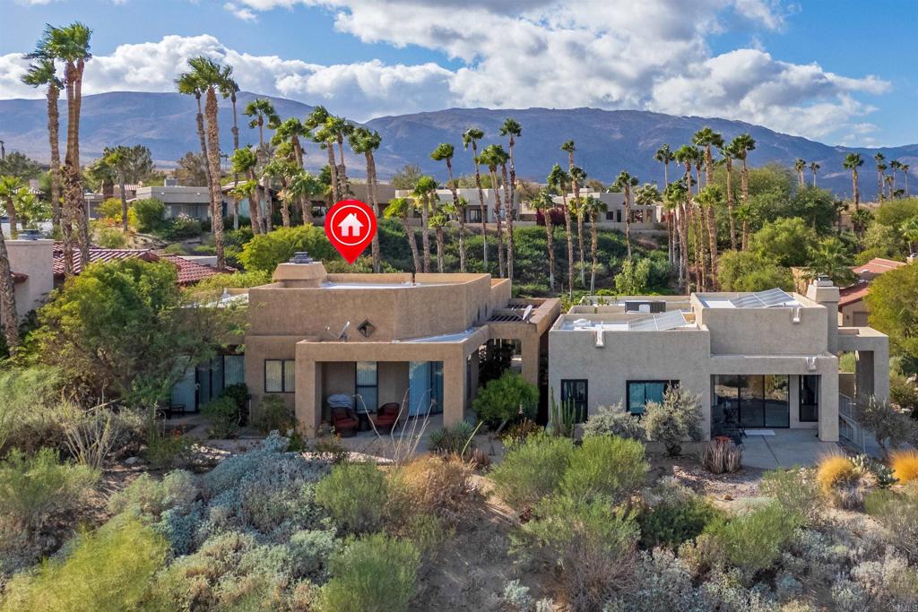 Rare opportunity to own this well designed and appointed two-bedroom, two-bath desert home with fabulous mountain and golf course views. Floor plan offers maximum privacy with primary bedroom in one wing, guest quarters in another, all on one level. Stunning view takes in the 14th fairway and winning, aesthetically-acclaimed Tom Fazio golf course, backed by sweeping natural desert and mountain panorama. The orientation of the home assures a spectacular sky at sunrise and sunset. A lovely approach with water features, ponds and detached 2 car garage. A short five-minute walk to HOA lap pool, swimming pool, spa, tennis court and pickleball! An easy-care landscaped yard. Walking distance to Rams Hill Clubhouse. Adjacent to the 600,000 acres of Anza Borrego State Park. A true gem within Borrego Springs, the only certified Dark Sky Community in California. Located just 6 miles from Borrego Springs, this home is conveniently close to shopping, grocery stores, restaurants, and other essential services. Whether you're seeking stargazing, golf, hiking, cycling, art appreciation, or simply to relax, this home is the perfect desert retreat!