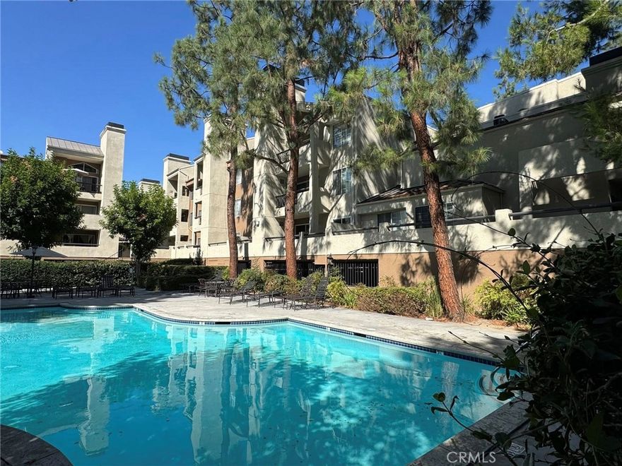 Welcome to your beautifully remodeled retreat in the heart of Woodland Hills. This turnkey condo in The Met offers the perfect blend of comfort, style, and resort-style living. As you step into this light-filled, open floor plan, you’ll immediately notice the modern kitchen with breakfast bar, flowing seamlessly into the living room with a sliding door leading to the private balcony, ideal for indoor/outdoor living. Both bedrooms are generous and served by full bathrooms, offering flexibility whether you need a home office, guest suite, or primary & secondary layout. The thoughtful remodel, done just two years ago, includes updated appliances, modern finishes, and finishes that appeal to today’s buyer.





Additional highlights:



In-unit laundry (stackable washer/dryer)



Upgraded water heater and electrical panel



Gas fireplace in the living room



Two tandem subterranean parking spaces



24/7 guard-gated entrance via the Juliana gate



Resort amenities including multiple pools, spa, tennis courts



This is a rare opportunity to own a stylish, secure, fully updated condo in a desirable Woodland Hills location — move in and start enjoying today.