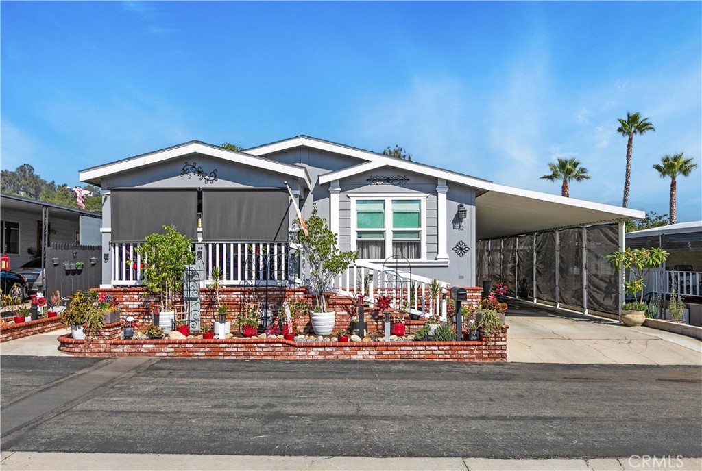 Welcome to 8651 Foothill Blvd #82 — a meticulously maintained and tastefully upgraded home offering style, comfort, and peace of mind. Step inside and immediately notice the attention to detail throughout every space. 2 Bedroom 2 bath with an office that can be turned into a 3 bedroom if needed.
Enjoy fresh landscaping with new gravel, new exterior paint, river rock, and elegant pavers leading to your private outdoor retreat. Custom privacy patio shades and a handcrafted wood fence create a serene setting for relaxing or entertaining.
This home comes equipped with four solar-powered Ring cameras, solar flood lights, and custom carport privacy shades for added security and convenience. The exterior is enhanced with Cemplank Lap Siding, Roof Ridge Vents, and dusk-to-dawn lighting for durability and efficiency.
Inside, experience comfort year-round with a Luxaire 4-ton single-stage HVAC system, new Sensi Wi-Fi thermostat, and electric smoke and carbon monoxide detectors with 9V backup.
The kitchen features a Whirlpool 4-piece stainless steel appliance package, upgraded faucets and fixtures, large single-bowl sink, and stylish two-tone cabinetry accented by custom lighting and wood valances. Govee under-cabinet lighting and Hubspace Wi-Fi deadbolt locks on both entry doors add a smart, modern touch.
Other highlights include upgraded light fixtures throughout, custom iron security doors, new Whirlpool washer and dryer, and monthly pest maintenance by Corky’s Pest Control.
This move-in-ready home blends thoughtful upgrades, energy efficiency, and smart-home features — all in a peaceful, well-kept community. Save on your electric bill as the solar panel are paid off.