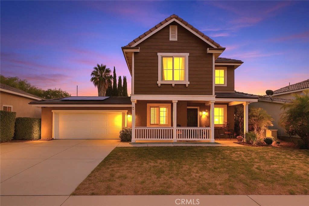 This beautifully maintained 4-bedroom, 2.5-bath home in the desirable South Pointe community of San Bernardino offers comfort, style, and space. From the moment you arrive, pride of ownership shines through, with inviting curb appeal and thoughtful upgrades throughout. Inside, wood laminate flooring flows across the main level and staircase, complementing a welcoming living room perfect for a study or reading nook, plus an additional sitting area and a convenient guest powder room. The open-concept kitchen and family room are ideal for entertaining, featuring upgraded granite countertops, a stylish tiled backsplash, a spacious island for barstool seating, and elegant plantation shutters on all downstairs windows. A cozy fireplace adds warmth and charm. Upstairs, all four bedrooms are generously sized and carpeted, with a shared full bath and a private master suite. The laundry area is also upstairs—no more hauling baskets up and down. The tandem third-car garage has been smartly converted into a bonus office space, perfect for remote work or creative projects. Step outside to a sprawling backyard, ideal for summer barbecues and gatherings, with ample room to add a pool if desired. This is a rare opportunity to own a spacious, upgraded home in a thriving neighborhood.