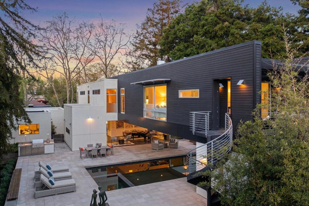 On a sunlight-dappled street in Barron Park, within a couple blocks of Juana Briones Park and top-rated schools, 4020 Amaranta was built for the future. This twenty-first century home design is modern, bold, dramatic and sustainable. Built in 2008, eco-friendly materials and resources were selected for positive health benefits to inhabitants and to reduce impact on the environment. With 5029+/- sq. ft. of interior living space across three levels, this automated home showcases a dynamic living room, an open kitchen, two offices, a family room, home theater, workout room, 4 bedrooms, 3.5 bathrooms, plus a poolside dressing room with one-half bath and an outside shower. When it comes to entertaining and enjoying the outdoors, the living rooms wall of glass opens to a beautiful and functional half-acre wonderland with a 50-ft-long pool, an integrated spa, expansive patio with outdoor kitchen, a greenhouse, garden beds, play areas, an orchard and a magical grove of majestic trees.