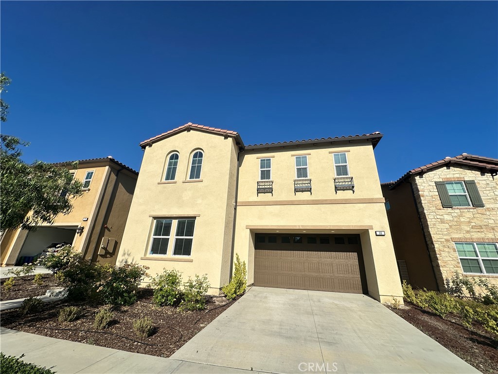 A gated residential community at Parkside in Lake Forest, just a 10-minute drive from Irvine's major park. Features custom tiled flooring and plush carpeting throughout the upper levels. This charming open-concept home offers five bedrooms and four bathrooms, including a spacious kitchen with upgraded cabinetry and a breakfast bar. Conveniently, there's a first-floor bedroom with an en-suite full bath. The second-floor loft area is ideal for multi-generational living. The home boasts impressive 10-foot ceilings on the first floor, 9-foot ceilings upstairs, and 8-foot interior doors. Located within the Saddleback Unified School District, ensuring access to top-tier schools. Easy highway access provides convenient routes for shopping and commuting. Enjoy peace of mind in this gated community, which offers its own pool and clubhouse for residents' leisure, and is directly across from Lake Forest Sports Park.