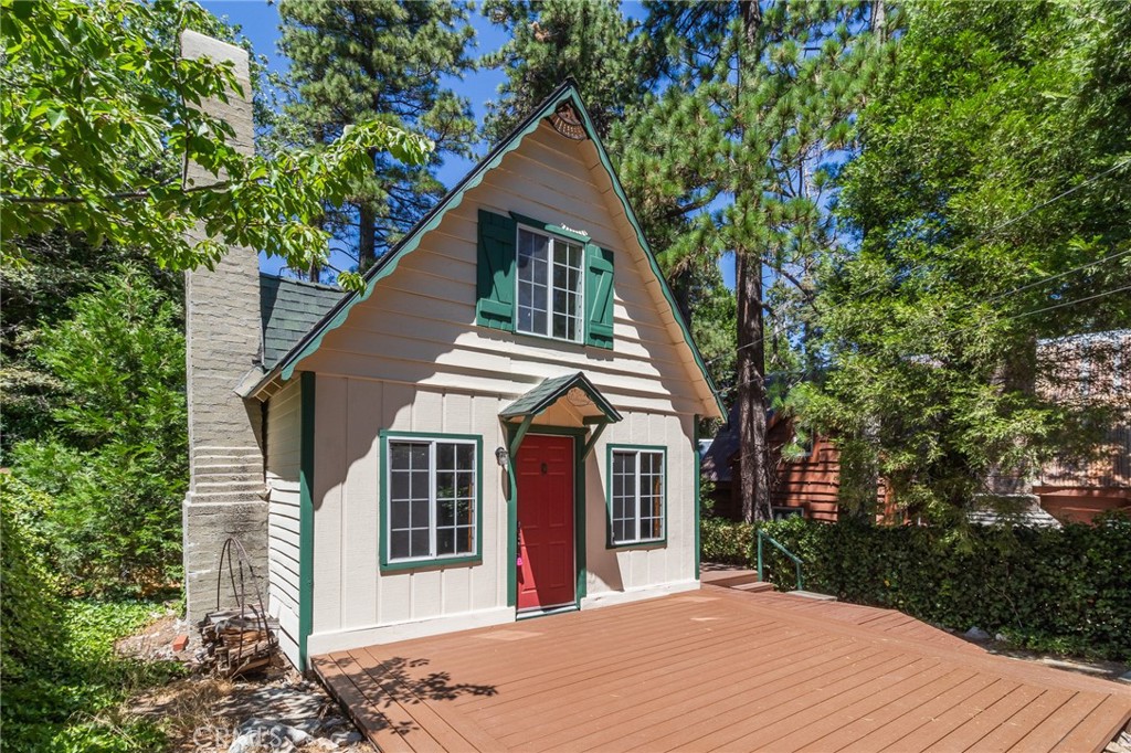 Discover the charm of this delightful home, perfectly positioned with level parking and a short stroll to the entrance. The serene garden setting creates a warm welcome, making you feel right at home. Inside, a cozy living room awaits, complete with a brick fireplace and comfortable furnishings. Enjoy the convenience of a main-level bedroom, spacious upstairs loft, and separate laundry room. The beautifully landscaped yard, complete with a patio area and ivy-adorned fence, is the perfect spot to relax. With its prime location near Blue Jay Village shopping and dining, this home offers endless possibilities.