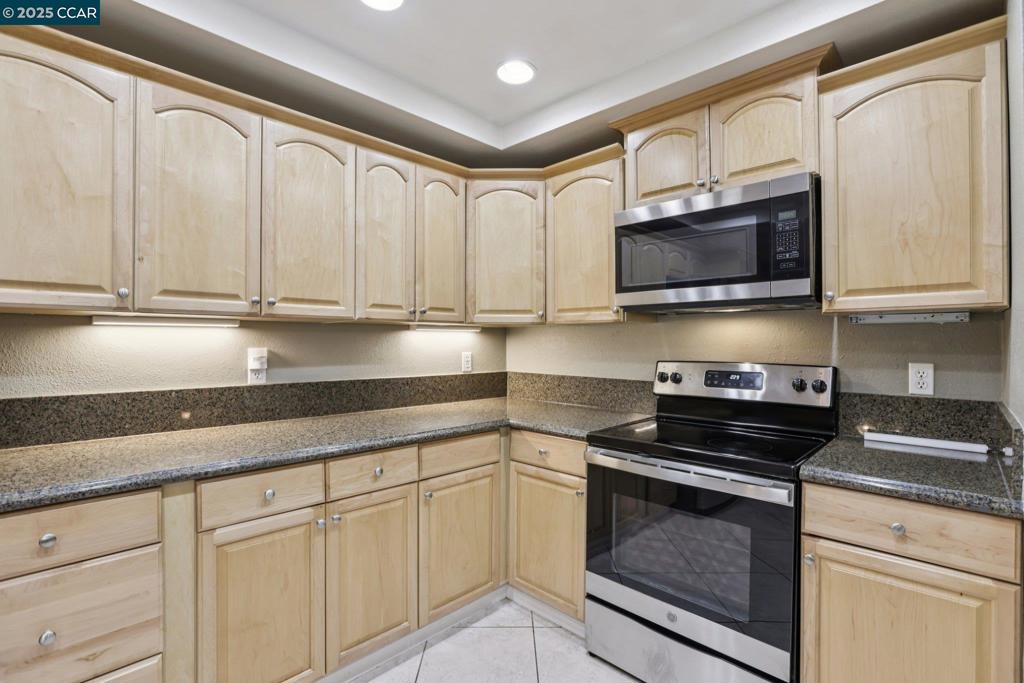 Spacious 3-Level Townhome with Views in Prime Moraga Location!  Move in before the holidays to this 2,200 sq. ft. home offering generous living space and serene views. Main level features a dramatic living room with soaring 20-ft ceilings and fireplace, dining area opening to a large entertaining deck, kitchen with granite counters, wood cabinetry & stainless-steel appliances, plus a guest bath. Upstairs primary suite includes a spacious bath and private deck with peekaboo views of the community pool & spa. An additional bedroom or office shares this level. Lower level includes two oversized bedrooms, full bath with dual sinks, laundry room, and hidden wine closet. 3-zone HVAC, direct-access 2-car garage. Quiet community with pool & spa. Conveniently located near Moraga Commons Park, Safeway Center, restaurants, retail, and the weekly Farmers Market. Apply with RentSpree https://apply.link/SpTIhe8