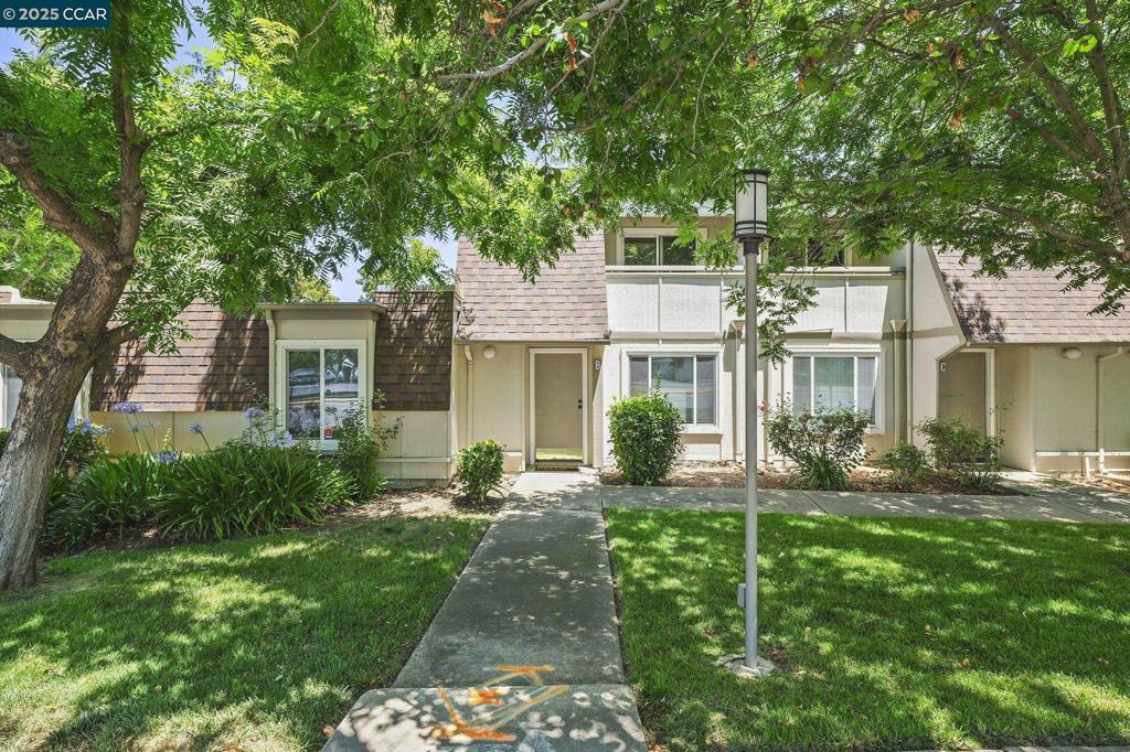 Discover this charming 2-bedroom residence located in Diablo Creek. Spanning 1,093 sq. ft., this two-story home features a landing with laundry hookups and both bedrooms conveniently situated on the upper level—one complete with walk in closet, the other a balcony. The main floor boasts a cozy living room, a dining area, and an updated kitchen equipped with updated cabinets, granite counters, stainless steel appliances and breakfast bar. Outdoors in the fully fenced patio offers additional storage, just steps away from two designated covered parking spaces. With central heating and air conditioning, and dual-pane windows for added comfort, this PUD (Planned unit developments get financing same as single family homes) is conveniently situated near shopping, dining, and entertainment options, including the Concord Pavilion. ---HOA dues $440 per month covers water, insurance on dwelling, exterior maintenance and grounds, community pool.