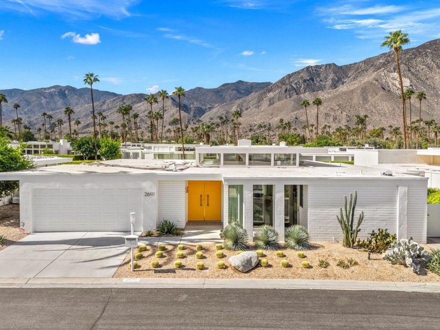 Set within the iconic Kings Point mid-century modern community of just 44 residences, designed by renowned architect William Krisel, homes in this exclusive South Palm Springs enclave are rarely available. Stunning and timeless, this home was completely remodeled and thoughtfully reimagined in 2024. It showcases iconic mid-century lines, high ceilings with clerestory windows, and seamless indoor-outdoor flow. The open-concept great room features walls of glass framing stunning mountain views, while the chef's kitchen boasts white oak cabinetry, quartz countertops, and premium appliances. The spacious primary suite offers a private retreat with direct patio access, a spa-like bathroom, and dressing room with custom wood cabinetry. Two additional en-suite bedrooms provide flexibility for guests or media space. Designed for entertaining, the home opens to a private patio with fire pit, BBQ, and inviting lounge area. Additional highlights include designer drapes, remote-control shades, Sonos sound system, custom fireplace, new flooring, 240v car outlet, and tankless water heater. Residents also enjoy tennis courts and two pools and spas, just steps away. Every detail of this home has been elevated, making this Krisel gem both architecturally significant and move-in ready.