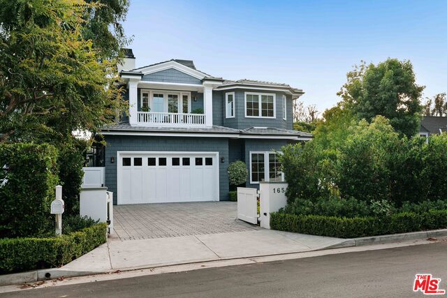 This bright and airy Traditional is located in the heart of Brentwood. Upon entry you are greeted with hardwood floors and high ceilings. The main level features a formal living room, dining room, gourmet chefs kitchen + breakfast area, and a temperature-controlled glass wine cellar. The open living room and kitchen, complete with marble countertops, a large island, and stainless steel appliances, open to the entertainers patio and sprawling lawn with sparkling pool + spa. Great for indoor/outdoor living and entertaining. Upstairs youll find four guest bedrooms, all with en-suite bathrooms, and the luxurious main suite. The main bedroom features walk-in closets, a fireplace, and a balcony for your morning coffee. Its bathroom features a dual vanity, soaking tub, and rain shower. To top it off this home is a fully automated Savant home all operable right from your phone. This home is truly turn key.