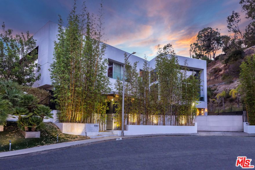 Sale price reflects deferred maintenance and an approx. $4m+ soon-required remodel. A contemporary architectural masterpiece in the Beverly Hills adjacent Bird Streets, with panoramic views of the city and ocean. Perched at the end of a cul-de-sac, this designer estate with guest house sits on over an acre of land with complete privacy. Offering over 8,000 sq. ft. of meticulously crafted living space, including an oversized master suite with an expansive private deck and luxurious master bath, an additional 4 beds, 7 baths, and movie theater. Pocketing Fleetwood doors open from a custom gourmet chef's kitchen to a massive entertainer's yard, replete with large grassy lawn and wooden deck, infinity edge pool and private spa, and multiple fire features.