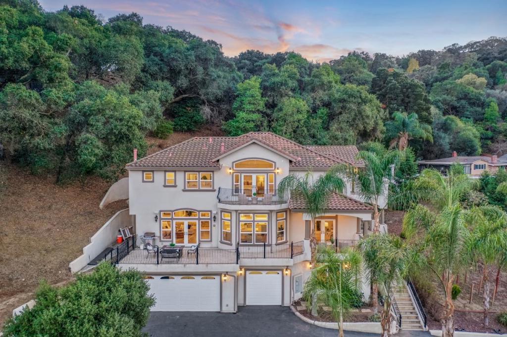 A true luxury retreat in Almaden's prestigious Oak Canyon neighborhood. Privately set behind a palm-lined driveway and accessed via a gated private road, this exceptional residence offers unobstructed Almaden Valley views from every room. Designed for effortless living and entertaining, the home features a low-maintenance landscape, expansive patios, and seamless indoor-outdoor flow. At its heart is a chef's kitchen and stylish wet barperfect for hosting with ease. The oversized primary suite is a private sanctuary with a dual-sided fireplace and spa-like soaking tub overlooking the valley. Additional highlights include a 3-car garage, flexible layout, and proven performance as a high-end Airbnb. Just 4 minutes to Almaden Quicksilver Park and 7 minutes to the Almaden Country Club, this property blends luxury, privacy, and access to outdoor recreational just a short drive from the energy of Silicon Valley. No showing until first open house 8/23, 12-3 PM. FAQ available upon request. The property has an elevator that accesses all floors, disclosures available upon request.
