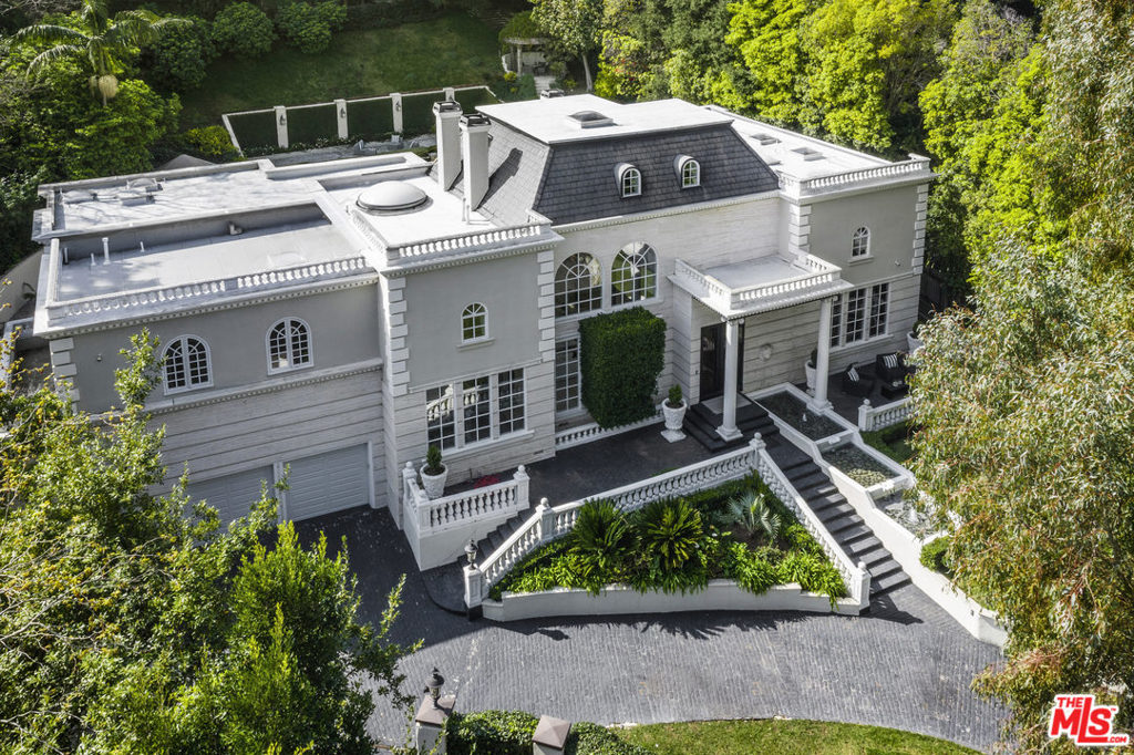A masterpiece of its own accord, this lavish French contemporary-style estate on Stone Canyon was completely renovated & remodeled in 2015. Completely turnkey, this gated residence situated in "Old Bel-Air" offers a stately staircase, a two-story living room with French doors opening to awe-inspiring outdoor areas & a formal dining room of the most exquisite taste. A modern & stylish eat-in kitchen, enjoyable family room & separate adult living room with office provides great space for family living. Optimal for entertaining, enjoy a seamless indoor/outdoor flow epitomizing tranquility with a covered heated patio, pool, masterfully constructed fountain, & covered lounge area with a fireplace. Planted on about an acre of Bel-Air's most pristine land, the private backyard haven also features multiple terraces, a gas firepit, a wrought iron gazebo and peaceful hiking trails. Enhanced with smart technology, this polished & modern abode is truly a private sanctuary in the heart of Bel-Air.