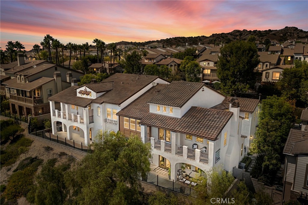 City Lights & Catalina Island Views from a Luxury San Lorenzo Home! Welcome to San Lorenzo at Vista Del Verde, one of Yorba Linda’s most sought-after communities, perfectly situated on the award-winning Black Gold Golf Course. This upgraded 2,600+ sq ft Plan Four (the largest model in the neighborhood) combines style, convenience, and breathtaking views — with the bonus of single-level living above your garage and a private in-home elevator.
Inside, the home offers 3 spacious bedrooms (one currently an office) and 2.5 bathrooms, along with thoughtful upgrades like brand new carpet, hardwood floors, new interior paint, and custom built-ins. The floor plan is designed for both entertaining and everyday living: Formal living and dining rooms for hosting gatherings. A chef’s kitchen with granite countertops, center island seating, stainless steel appliances, and breakfast nook with built-in desk area. Large great room with cozy fireplace, surround sound, and custom built-ins. Primary suite retreat with walk-in closet, and spa-like ensuite featuring dual vanities, a soaking tub, and walk-in shower. Enjoy two covered outdoor decks where you can take in sweeping city light views that stretch to Catalina Island — perfect for evening sunsets or weekend hangouts.
Additional highlights include: Convenient inside laundry room with sink Finished 2-car garage with plenty of storage cabinetry.
Community amenities: resort-style pool, spa, BBQ area, and clubhouse HOA covers exterior maintenance including roof, paint, and fire insurance Set within the top-rated Placentia-Yorba Linda School District, and surrounded by miles of scenic trails for biking, hiking, and horseback riding, this home offers the best of Yorba Linda living — luxury, low-maintenance, and unforgettable views.