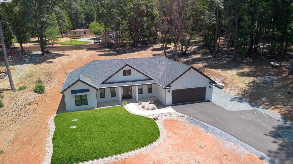 Built in 2022 in the popular Todd Valley neighborhood. This beautiful single story home boosts 3 bedrooms plus an additional room that is currently used as an office. The gorgeous open concept kitchen shines with white cabinetry and a large family style island. You will warm the home, Conserve energy and create ambiance with the newly installed pellet stove. Enjoy the peaceful quiet setting. This home is set back from the road with a long generous driveway, plenty of parking for visitors or large vehicles. Situated on one acre, perfect for an outdoor kitchen, pool or ADU.