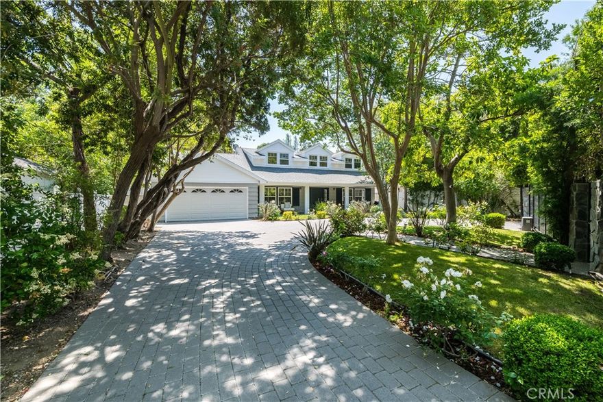 Welcome to this remodeled oasis south of Ventura Blvd in a highly desirable Studio City neighborhood. This stunning two-story home is set back from the street on an oversized 11,488 sf fully gated lot, offering complete privacy. A circular driveway leading to a two-car garage. The interior boasts a chef's kitchen centered around a huge island and equipped with high-end appliances. Updated bathrooms are elegantly appointed with contemporary finishes.  Large and tastefully landscaped backyard is an entertainer's dream, providing seamless indoor-outdoor living with a spacious patio, a built-in barbecue, and a huge salt water heated swimming pool, all designed to accommodate large gatherings.  Modern conveniences include a whole-house water filtration system. This home is located within walking distance to coveted Carpenter Community Charter elementary school.