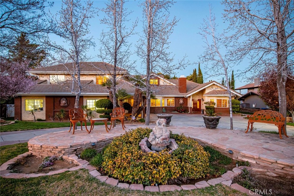 GORGEOUS GATED GODDE HILL ESTATES CUSTOM YOU WILL BE PROUD TO CALL HOME. This mostly Single Story (with only a Bedroom and Full Bathroom upstairs) boasts custom finish you will see only in the finest homes. And it is located in MOST PRESTIGIOUS gated subdivision. When you come through the gates it is as though you are no longer in the Antelope Valley. Each home was Custom Built for rich variety and class. The Mature Landscaping gives the community a Lush Feel. As you enter this unique 4500+ sq ft home you will appreciate Rich Finish including Hardwood Flooring, Expansive Rooms, High Ceilings and Crown Molding. Formal Living and Dining Rooms are great for entertaining. The Family Room is Impressive with Dramatic Wood Ceilings and accents, a Floor to Ceiling Brick Fireplace nestled in one corner with Raised Hearth and Detailed, Crafted Mantle. There is also a Wet bar for entertaining. The Family Room is adjacent to the Chef's Kitchen perfect for family living. The Rich Granite Countertops, Stainless Appliances, Large Center Island with Vegetable Sink, Arched Brick Range/Hood Niche, Dual Ovens, Built in Refrig/Freezer, Breakfast Bar and Large Pantry all make cooking a pleasure. The Master Suite is Huge with High Ceilings, a Sitting Area with Cozy Fireplace, 2 Walkin Closets with Builtins and French Doors to back Patio/Pool/Spa is perfect. The Master Bath features Dual Sinks, Spa Tub, Oversized Shower and Marble Flooring. There 4 are additional Bedrooms. One is set up as a large Gym a another as a Private Office with Builtins. There is also Paid For Solar. Outside is made to Entertain with a Covered Patio wrapping around the house, a Builtin BBQ, a Firepit, Lush Landscaping, a Fountain and an old world Gazebo. You'll love the Pebble Tech Pool and Spa with its Waterfalls and Grotto--Perfect for warm summer days. You won't want to miss this Beautifully Crafted Home in Desired Godde Hill Estate.