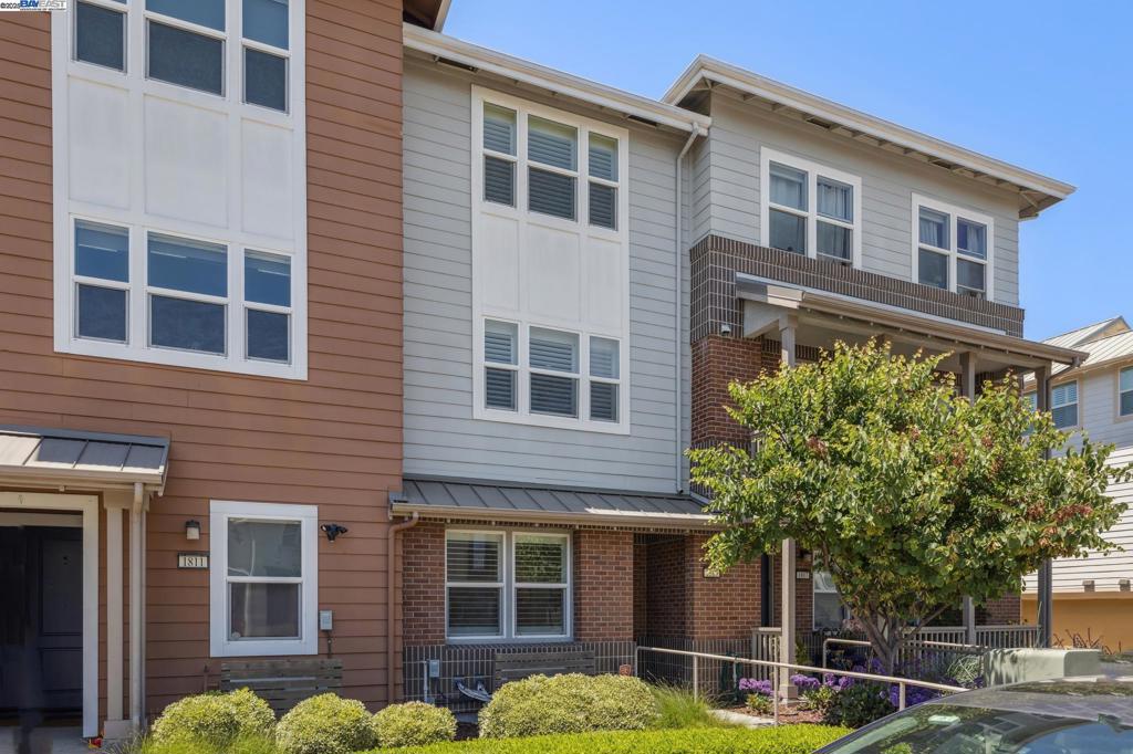 Built in 2016, this 3 bed, 3.5 bath tri-level home offers 1,727 sq ft of thoughtfully designed living space in a prime central location. Each bedroom features its own en suite bathroom, offering ideal privacy and comfort. The first floor features a private bedroom with a full bath, including a stall shower. On the second floor, enjoy an open-concept layout that seamlessly combines the kitchen, dining and living room, along with a convenient half bath. Highlights include recessed lighting, LVP flooring, a built-in bookshelf, and a patio slider to a covered outdoor lounge area. The kitchen is equipped with stainless steel appliances, glass tile backsplash, dark gray quartz countertops and plantation shutters. Upstairs, the primary suite boasts a double vanity and tiled stall shower with a built-in bench. The third bedroom features its own bathroom, complete with a shower over the tub, and the laundry room is conveniently located on this level. The attached two-car garage features epoxy flooring, overhead storage and an EV charger. Enjoy easy access on and off the island via Park St Bridge or Webster/Posey Tube. Close to Marina Cove Park, shops, restaurants and local markets. Open House Sat & Sun 2-4pm.