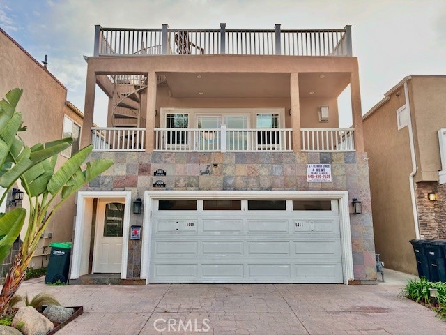 This is the upper 3-bedroom 2 bath condo with private rooftop deck- that was recently remodeled and boasts high-end finishes throughout. It’s 3 houses from the sand. The unit has new wood and travertine floors, granite countertops, a fireplace, stainless steel appliances, wet bar, including a refrigerator, crown molding throughout the unit, and high-end finishes. With new plank wood floors and fresh new paint throughout. The unit has a garage and additional parking space on the driveway.