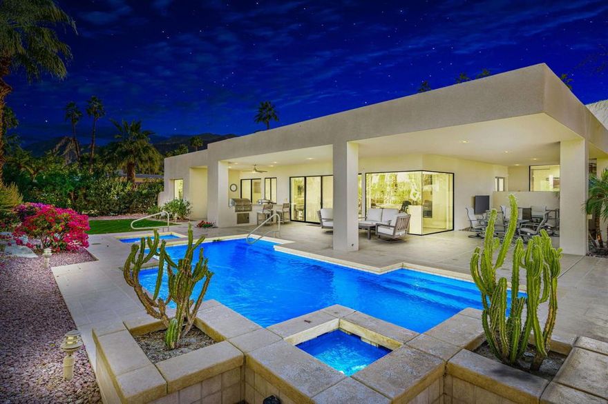 Experience the beauty and luxury of this stunning contemporary Thunderbird Heights home, featuring breathtaking views that will leave you in awe.  The sleek and tastefully remodeled kitchen boasts top-of-the-line appliances, including dual dishwashers, a full-size wine refrigerator and a Sub Zero fridge, seamlessly flowing into a sunlit breakfast room with magnificent mountain views, creating a serene start to your day. The large formal dining room continues the theme with  windows wrapping around to frame those breathtaking vistas. The spacious family room features a fireplace, custom built-ins plus a full bar equipped with dishwasher, ice maker & a refrigerator, all with expansive views that lead to a generous patio. Step outside to discover a magnificent and expansive patio complete with a swimmers pool, spa, and a built-in BBQ including an outdoor griddle perfect for entertaining and enjoying the great outdoors. Enjoy the stunning gardens and an array of amazing fruit trees that enhance the outdoor experience, making this home a true sanctuary. The primary bedroom includes a cozy retreat area ideal for a gym or office, complemented by spectacular views, plus two full bathrooms, a step-in shower and soaking tub and ample closet space. Additionally two oversized, en-suite guest rooms provide an ideal retreat for guests. A spacious den or family room provides additional gathering space and opens up to a beautiful private patio. No expense was spared and has been meticulously maintained, ensuring comfort and peace of mind from the solar panel system and generator to the air-conditioned garage.  Additional features include EV charger, tankless water heater, 3 newer air conditioning units and 3 humidifiers throughout the home. Discover the perfect blend of elegance and functionality in every corner.