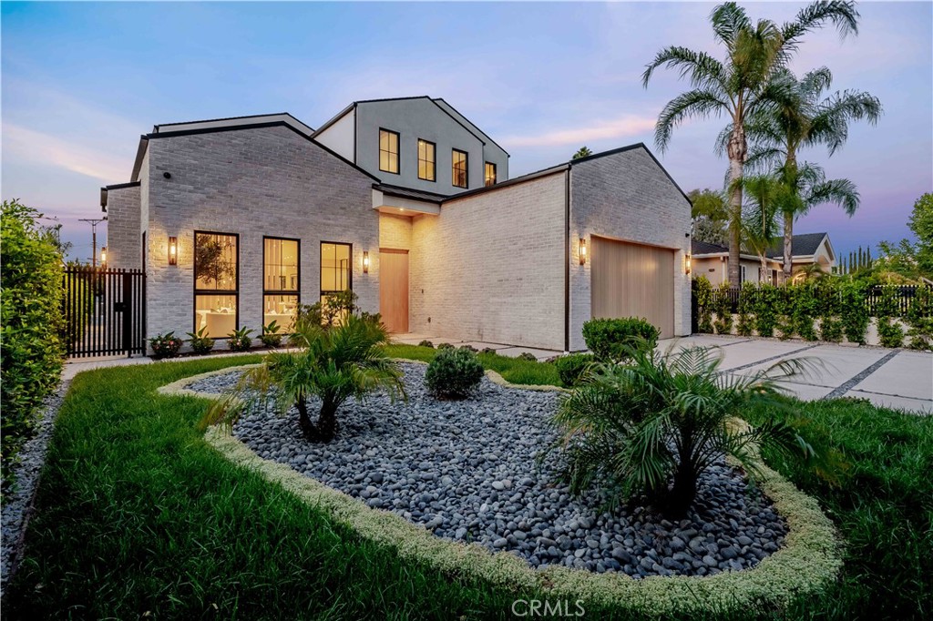 Expertly crafted from the ground up, this newly constructed modern residence offers approximately 6,458 square feet of living space, complemented by a 228-square-foot covered patio—blending architectural elegance with contemporary comfort. With six bedrooms and seven bathrooms, the home is thoughtfully designed for both grand entertaining and effortless everyday living. The first floor impresses with soaring 11-foot ceilings and a dramatic living room anchored by a floor-to-ceiling crema calacatta fireplace. Custom built-in cabinetry, and artfully designed accent walls add warmth and texture throughout, while natural light enhances the home’s refined finishes. At the heart of the home lies a chef’s kitchen appointed with Miele appliances, including double ovens, a built-in coffee system, a turbo microwave, and a double refrigerator. Taj Mahal quartz countertops, a sunlit breakfast nook, and a walk-through butler’s pantry—seamlessly connecting to the formal dining room—complete the space. Outdoors, a spacious covered patio with its own fireplace creates a welcoming setting for relaxation or evening gatherings. Just beyond, a separate BBQ station with built-in grill and outdoor refrigerator is perfectly positioned for effortless entertaining. A non-slip basketball sport court and expansive lawn provide additional recreation and leisure, while a detached ADU—complete with a living room, kitchenette, and en suite bedroom—perfect for extended guests or flexible living needs. Upstairs, four generously proportioned bedrooms each offer the comfort and privacy of en suite baths. The primary suite is a refined sanctuary, featuring a striking white Travertino fireplace, an expansive walk-in closet, dual vanities, a luxurious soaking tub, an oversized glass-enclosed shower, and a private balcony overlooking the serene grounds. A spacious upstairs laundry room enhances everyday ease. Additional features include a dedicated study, a state-of-the-art home theatre, Control4X smart home technology, home audio system and a two-car garage. Every space has been thoughtfully considered, resulting in a residence that offers both refined design and modern comfort.