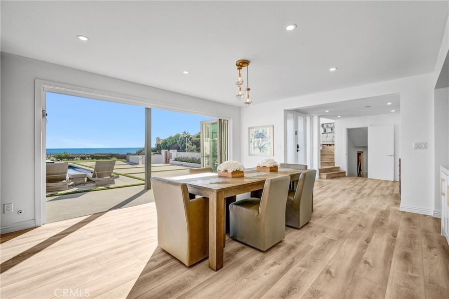 Welcome home to this stunning Mid Century Modern ocean view residence located in highly sought after Monarch Bay Terrace, very close to pristine beaches in Monarch Beach, and recently remodeled with top of the line materials, folding doors, new flooring all through-out, all new kitchen with waterfall islands, new top-of-the-line appliances, fixtures & lighting. The amazing brand new outdoors with gorgeous pool, spa with waterfall, all new lighting and landscaping, built-in BBQ & firepit, all beautifully designed for year-round enjoyment of a fabulous outdoor setting, ocean views & gorgeous sunsets. As you enter through double entry doors to this very private, fully gated courtyard that leads you to elegant front doors to the main level with an open floor plan, which offers sets of folding doors creating the best indoor outdoor living. Beautiful living room, dining room & awesome kitchen all to enjoy great ocean views and a newly built full bath to be accessed from pool & spa, and a convenient laundry room and walk-in pantry too. A few steps up to mid-level to an amazing great room with 3 sets of tall sliding doors open to a balcony for enjoying even more stunning ocean views, while you entertain family and friends. The second floor offers an elegant primary suite with fireplace, while it opens to its own balcony, 3 other bedrooms, 2 of which feature great ocean views overlooking gorgeous pool & spa with falls, 4th bedroom overlooks the very serene backyard with grown trees.  With a very short drive, one can visit 3 of the fabulous five-star resorts of Montage, Ritz Carlton, Waldorf Astoria, and the adjacent Monarch Golf resort and their great restaurants as well as Dana Point Harbor & Laguna Beach, the Newport Harbor & Fashion Island in Newport are not too far away.