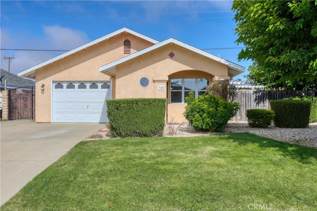 Welcome to this delightful 3-bedroom, 1.5-bathroom home offering 1,106 square feet of comfortable living space. Nestled in a quiet and established neighborhood, this property boasts a nicely landscaped front yard and inviting curb appeal. Step inside to a bright living room with tile flooring that seamlessly flows into the open-concept kitchen—perfect for everyday living and entertaining. The kitchen offers direct access to a private back patio, ideal for relaxing or hosting gatherings. The primary bedroom includes a convenient half bath, while two additional bedrooms share a full hallway bathroom. An oversized single-car garage provides ample storage space along with a dedicated laundry area. The sizable backyard is a true highlight—offering plenty of room for gardening, entertaining, or enjoying the Central Coast sunshine. Conveniently located near excellent schools, Nipomo Regional Park, golf courses, and just a short drive to picturesque beaches and world-class wineries, this home presents an incredible opportunity for first-time buyers, downsizers, or investors.