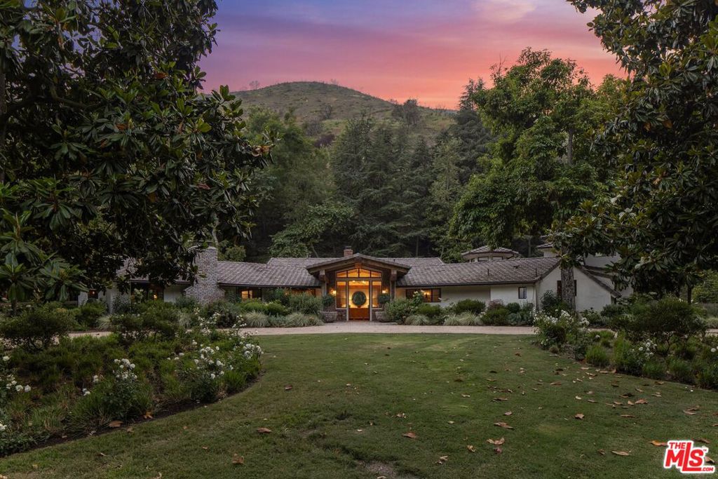 Welcome to the legendary Robert Taylor Ranch, once the cherished home of Golden Age icons Robert Taylor and Barbara Stanwyck, now reimagined as Brentwood's most iconic residential estate. Set across 112 private acres with sweeping canyon and ocean views, this storied property fuses classic California ranch charm with world-class contemporary design.Originally built in 1950 by renowned architect Robert Byrd and completely re-envisioned by top-tier designers, the estate now offers approximately 20,000 square feet of exquisitely crafted living space. Every inch has been upgraded to the highest modern standards while preserving its classic California ranch roots. At the heart of the estate lies the main residence, featuring 5-7 bedrooms, depending on configuration.Highlights include: a glamorous primary suite with a steam shower, infrared sauna and boutique-style walk-in closet, three additional skylit en-suites, a large studio/flex space, a private theatre, fitness studio and a dramatic two-story guest wing with full kitchen, bedroom and office ideal for a live-in assistant or private quarters. Outside, the stunning backyard features a solar-heated pool and a full outdoor kitchen with a grill and pizza oven. The property also includes two detached guest casitas each with 2 bedrooms, 2 bathrooms, full kitchens, laundry and living rooms - perfect for multigenerational living, staff or extended guests. Then lastly, a fully renovated horse barn with a tack room, stable manager's office, break room, full bathroom, four-car garage and abundant storage make up the equestrian facilities.The property is comprised of approximately 13 acres of flat land and nearly 100 acres of surrounding canyons with private hiking trails and ocean vistas. It boasts all new systems throughout including an advanced fire-safety system, a private well, a generator, updated electrical, plumbing, HVAC, security and AV, offering peace of mind and seamless functionality.Tucked away in one of Los Angeles' most exclusive, celebrity-filled enclaves, the Robert Taylor Ranch is just 15 minutes from the Brentwood Country Mart and 25 minutes to Beverly Hills. This extraordinary estate offers complete privacy, prestige, and scale without sacrificing access to the best of the city.