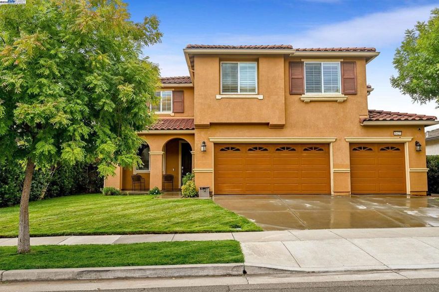 Stunning, high-upgrade single-family home with luxury finishes. This immaculate 5-beds, 3-bath residence spans ~3,477 sq ft and includes an attached 3-car garage. A full bedroom and bath on the 1st floor adds versatility for guests, a home office, or multi-generational living. A large loft on the 2nd floor provides additional flexible living space for gathering, a home gym or quiet retreat. The 1st floor features pristine hardwoods, while the 2nd floor has plush upgraded carpeting. All bathrooms boast stylish tile flooring, adding durability and a polished, cohesive look throughout the home.  The chef-inspired kitchen shines with stainless steel appliances, abundant upgraded cabinets, granite countertops and backsplash, island, pantry, double ovens, a new gas stove, and a refreshed faucet. Laundry with washer/dryer, sink, and built-in cabinets enhances convenience. The spacious primary suite offers a spa-like bath with dual vanities, a separate tub and shower, and a large walk-in closet. Step outside to a beautifully landscaped backyard with manicured lawns, pavers, and no rear neighbors for privacy. Upgraded solar power and no HOA dues add energy efficiency and ease of ownership. This turnkey home blends luxury, functionality, and value, ready for you to move in and enjoy.