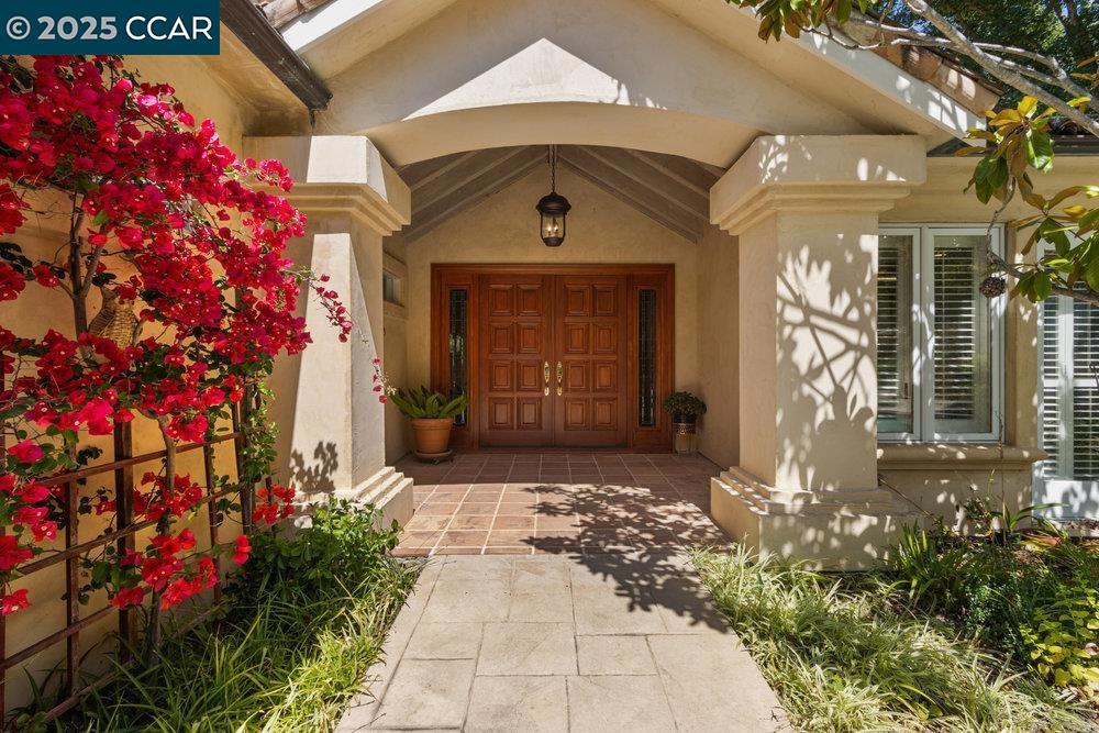 Welcome to your own private oasis, tucked behind a secure gate on a serene 1.32-acre hillside parcel.This extraordinary estate blends elegant architecture, thoughtful design, and breathtaking natural surroundings to create a resort-style retreat you’ll call home. A concrete driveway guides you past lush surroundings to an upper patio and expansive outdoor entertaining space.The main level features an open-concept great room with soaring ceilings and walls of windows that showcase breathtaking hillside views. One of the two resort-style primary suites is conveniently located on the first floor, perfect for in-law and guests.The chef’s kitchen boasts a dramatic design with an oversized granite island, high-end appliances and abundant counter space. The lower level features two additional primary suites, along with a generously sized bonus room that serves as a flexible recreation space. Multiple decks surround the home and are accessible from nearly every interior room, offering seamless indoor-outdoor living. A beautifully landscaped backyard with towering trees that provide shade on warm summer days, a built-in BBQ, and a sparkling pool and spa—perfect for entertaining. This home is the epitome of relaxed luxury, where comfort, style, and privacy come together in perfect harmony.