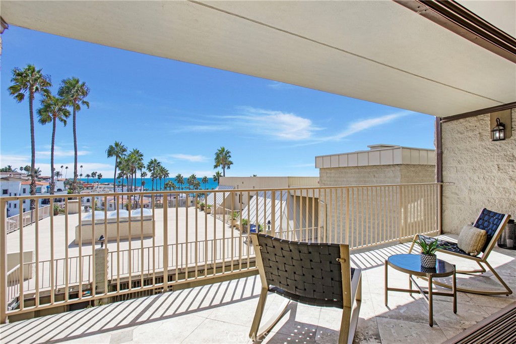 Whoever may have said “You can’t have it all” definitely did not see this condo! With an azure oceanside view and balcony that seamlessly flows connecting inside with outdoors, it is a homeowner’s personal piece of paradise. The condo was remodeled into 1 bedroom to create the open living spacious feel and can be converted into its original 2 bedroom floorplan. The gorgeous kitchen gleams with spotless white cabinets, just-like-new stainless steel appliances including wine fridge, and farmhouse sink. Adjacent is a comfortable living area and two dining spaces, one of which is barstool seating. Large format tile and high ceilings lend lift and light enlarging this well-designed area. The bedroom boasts plenty of closet space plus a beautifully tiled ensuite complete with soaker tub and dual sinks. A large sliding door provides access to the patio and an outstanding view for morning coffee or evening cocktails. Concealed behind a set of folding doors lies a laundry/storage area. Although the condo complex is practically oceanside, it also has a pool, hot tub, large patio area, and parking. Old Town San Clemente, historical sites including the pier, museums, parks, and everything ocean are nearby.