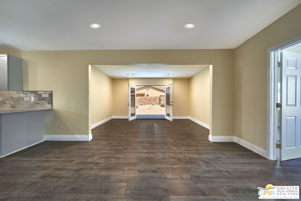 Totally remodeled interior from floor to ceiling! Single-story 3 bedroom, 2 bathroom with attached garage located in the sought-after Cove neighborhood, in the northern portion of the of the magical La Quinta desert community, right next door to La Quinta Community Park with recreational pool, playgrounds, tennis and pickleball courts, shopping and retail. Fresh, new construction that includes engineered wood flooring throughout, new appliances, new quartz counter tops, new cabinets, new flush-mount recessed lighting, new stone subway tile back splash, new dual-sink vanity, new subway and mosaic tile shower, and new interior and exterior paint. Separate inside laundry room. Central AC and heat. New large concrete patio off of back french doors. Mature citrus tree and drought tolerant landscaping.