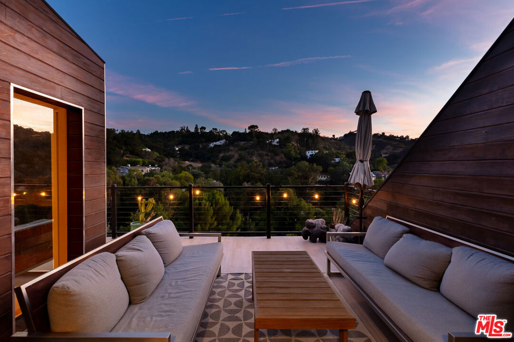 Tucked away in the hills of Studio City, this recently renovated contemporary home offers sweeping views from nearly every room. Surrounded by peaceful canyon scenery, the property feels worlds apart from city lifeyet it's only moments from Ventura Boulevard.The main level showcases an open floor plan where living, dining, and entertaining areas connect effortlessly. Floor-to-ceiling glass fills the space with natural light, while sliding doors extend the interiors to a spacious outdoor patioperfect for dining under the stars and enjoying the dramatic vistas. The kitchen is highlighted by a large central island and sleek stainless steel appliances.On the lower level, you'll find a private ensuite bedroom as well as the expansive primary suite, complete with a fireplace, dual walk-in closets, and a spa-inspired bath featuring a soaking tub, rainfall shower, and double vanities. The bottom floor includes another bedroom, a shared bath, and a professionally soundproofed recording studio.A separate 345 sq. ft. guest house sits just below the main residence, accessed through its own gated entry. It offers a kitchenette, bathroom, detached laundry room, and two sets of sliding glass doors that capture the canyon views. Usage of this ADU can be included for 18k/month.Multiple decks on every level overlook the canyon, creating a seamless connection between indoor and outdoor living. Additional features include a two-car garage with built-in storage, laundry, and an EV charger, plus two extra parking spaces, and a gated front courtyard.