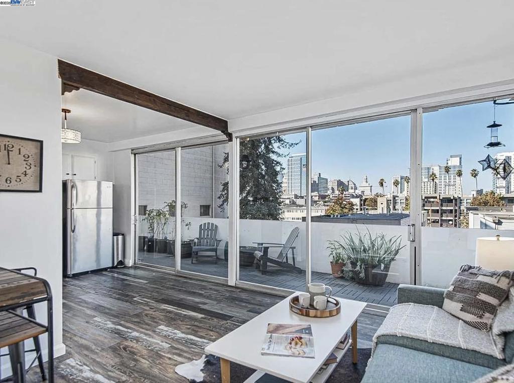 Experience elevated urban living on the shores of Lake Merritt. This beautifully updated condo boasts expansive patios with panoramic sunset and city views, all framed by floor-to-ceiling sliding glass doors. Inside, enjoy a seamless open floor plan, an eat-in kitchen with granite countertops and stainless steel appliances, and elegant updates throughout—including custom paint, modern flooring, chic lighting, and refreshed bathroom vanities. This secure, amenity-rich building features 24/7 security, a full-time lobby attendant, a gated garage with deeded parking and private storage, an on-site laundry facility, and a stylish community mezzanine for gatherings or quiet moments. Just two blocks from BART and moments from top-tier schools, dining, and shopping—this is the ideal balance of luxury, lifestyle, and location.