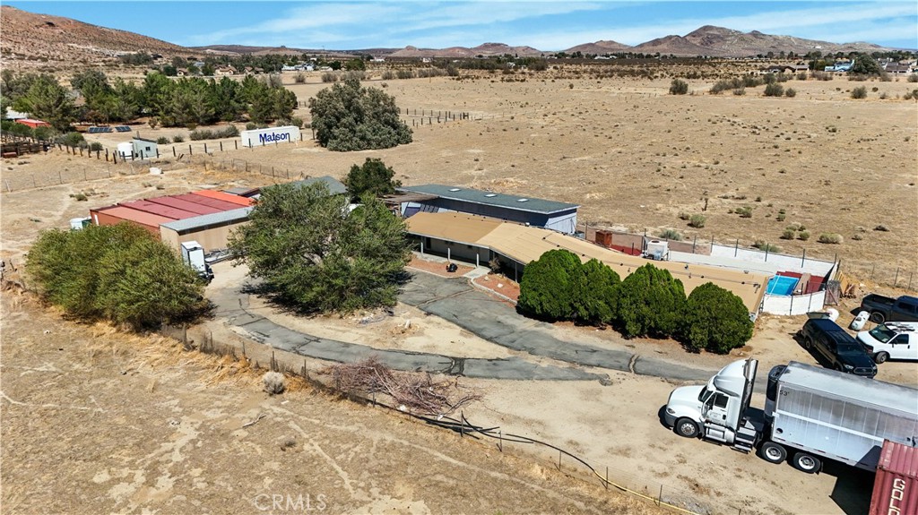 Secluded Oasis with Pool, Private Well & Endless Potential in Rosamond
Welcome to your private desert retreat in the heart of Rosamond, just minutes from the iconic Willow Springs International Raceway. Tucked away from the main road, this one-of-a-kind property is accessed by its own private driveway that leads directly and exclusively to the home, offering unmatched privacy and a true sense of escape. As you approach the residence, a gated entrance near the structure provides added security and seclusion, opening up to a spacious layout with room to breathe, build, or simply enjoy the wide-open surroundings.
This fully fenced property is ideal for those who value space and versatility. A sparkling pool invites you to relax under the desert sky, while a large 3-car garage and an oversized storage building provide ample space for vehicles, tools, or creative projects. Additionally, the property includes five storage containers which are perfect for storing equipment, setting up a workshop, or so much. Whether you're a hobbyist, entrepreneur, or simply someone looking to live off the beaten path, this setup offers endless potential.
One of the standout features is the recently installed 4,000-gallon private well that supplies water exclusively to the property. With no water bills to worry about, you'll enjoy both independence and long-term cost savings. The surrounding land offers more than just space, it offers opportunity. Whether you're dreaming of expanding, starting a home-based business, or creating your own desert sanctuary, this property is ready to bring your vision to life.
If you’re looking for a unique blend of privacy, functionality, and potential, all in a peaceful yet accessible Rosamond location, this property is a rare find. Come see it for yourself and imagine the possibilities.