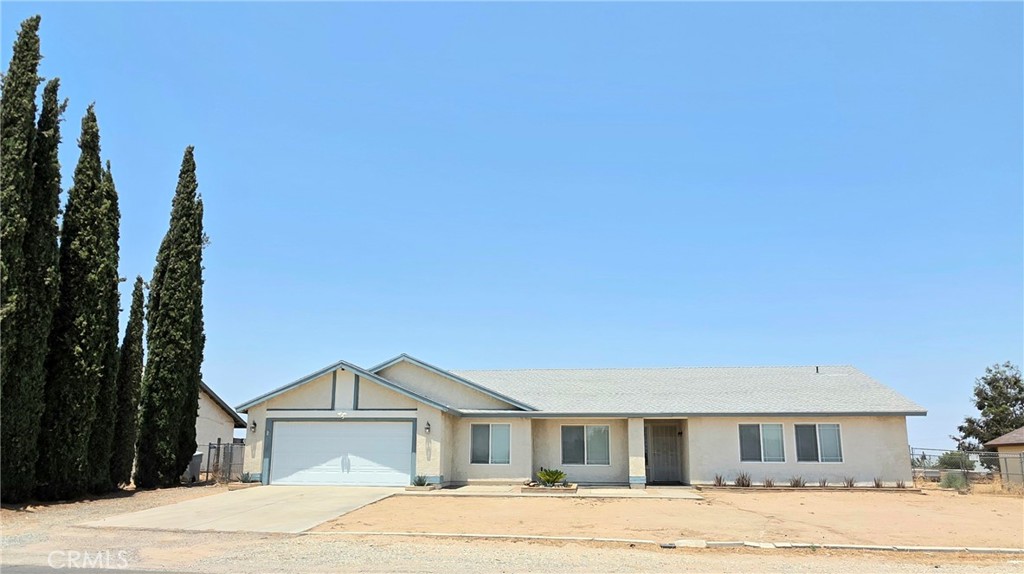 Beautiful and spacious property in the city of Hesperia. Featuring 3 bedroom, 2 bath with a bonus room that could be used as a home office or a guest bedroom with lots of storage and a 2 car garage. Vaulted ceiling with recess lighting and a fireplace. Modern kitchen with quarts counter tops and stainless steel appliances. Laminated wood floors and the bedrooms have carpet. Lots of natural light and modern colors. The primary bedroom has 2 closets and double sinks in the bathroom suite. Large backyard with a covered patio and a shed for additional storage. Gated dog run and an outdoor dog kennel. Side gate for RV parking or for toys and to park your boat. Right of the15 Fwy and close to many stores and restaurants nearby.