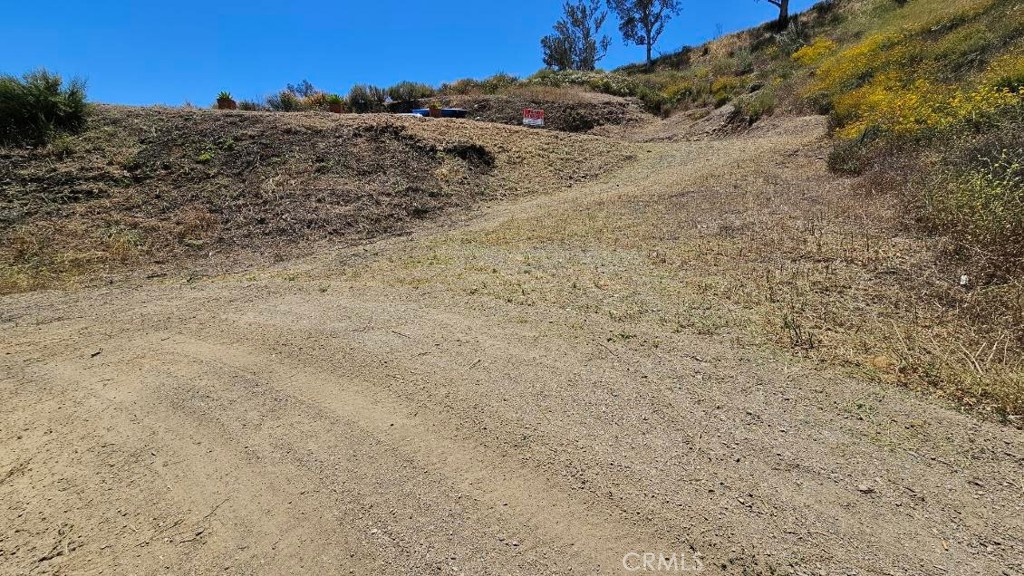 Welcome to 0 Sunny Slope Ave, a promising vacant lot located in the scenic and rapidly developing city of Lake Elsinore. Spanning 4,356 square feet, this parcel presents a fantastic opportunity for those looking to build a custom home, invest in land, or add to their real estate portfolio. Situated in a peaceful residential neighborhood, the lot offers a sense of tranquility while still being conveniently close to shopping centers, schools, parks, and recreational amenities—including the beautiful Lake Elsinore itself, perfect for boating, fishing, and outdoor adventures.
Whether you’re an investor seeking a long-term asset or a homeowner envisioning a future custom build, this parcel provides a flexible canvas with tremendous potential. With easy access to the I-15 freeway, commuting to nearby cities is seamless, making this location ideal for those seeking both serenity and accessibility. Don’t miss the chance to own a piece of Southern California land in a growing community—opportunities like this are becoming increasingly rare!