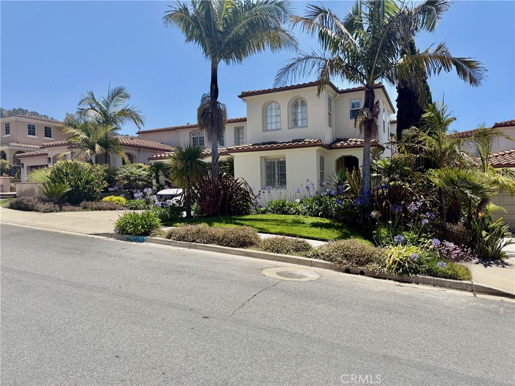 Welcome to this spectacular home located in one of the best locations along the Central Coast! This 5 bedroom 4 1/2 bath home is not only designed for family living but ideal for entertaining both inside and out. Throughout the lower level, gorgeous pillow top travertine floors grace the living room, dining room, kitchen and family room. Soaring 25 foot ceilings as you enter this home with tons of windows providing natural light throughout. The kitchen features granite counters, walk-In pantry, stainless appliances with double oven, wine refrigerator and a huge island with a breakfast bar.The family room is located directly off the kitchen and features a cozy fireplace and plenty of room for the family. It leads to the rear yard that designed for entertaining year around with an outdoor kitchen, fire pit, built-In BBQ and an area with a covered patio with plenty of seating all around. The spacious rear yard offers plenty of space for gardening, entertaining and even has room for a pool! Additionally the main level has a guest bedroom, 1 full bath, powder room, laundry room and amazing theatre room featuring stadium seating, custom fabric wall coverings and handmade light fixtures! The remaining 4 bedrooms are located on the upper level. The primary bedroom has an en-suite bath with dual vanity sinks, soaking tub, walk-In shower and walk-In closet with custom built-In cabinetry. There is even a private deck with views of the ocean! There is an additional en-suite bedroom with its own private bath. The last two bedrooms share an interconnecting bathroom.This home is fully solar powered with battery capacity for up to approximately 36 hours off the grid. Direct beach access steps away, Beachcomber Park, tennis courts and hiking trails are close by. This large home is set up for family and guests in a community rarely available on Beachcomber Drive.