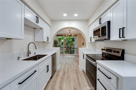 Photo of 104 Lakepines, Irvine, CA 92620 (MLS # OC26102089)