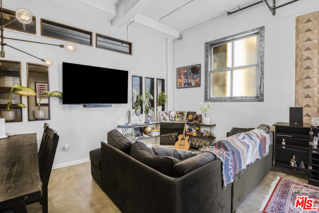 Spacious Live/Work LOFT at the Eckardt building located at Santee Court in the Fashion District. This upgraded unit has high ceilings, an open floor plan, concrete floors, a modern-designed kitchen with stainless steel appliances, and an in-unit washer & dryer. One fully enclosed bedroom with another room for an office or baby's room and a rare balcony. Dedicated parking space at nearby Maple St garage with a free shuttle that runs at night from the parking lot to the lofts. The Eckardt building has access to all the Santee Village amenities located on the same block including a rooftop pool & spas, a rooftop golf driving range, a rooftop basketball court, and a rooftop lounge area with BBQ, a fitness center, and retail on the bottom floor.