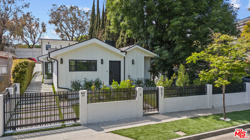 Location Location Location! Incredible Investment Opportunity in the heart of West Hollywood, this brand-new modern farmhouse, complete with a separate two-story ADU, offers 5 bedrooms and 5 bathrooms, showcasing French oakwood flooring and custom tile throughout. Each residence features its own chef's kitchen, outfitted with brand-new, top-of-the-line appliances including a Miele oven, JennAir refrigerator, and KitchenAid electric downdraft stove, all complemented by sleek, contemporary finishes. Ideally located just steps from the Sunset Strip, Catch LA, the Pacific Design Center, and some of the city's finest shopping and nightlife destinations. Gated and surrounded by mature hedges, this home offers the utmost privacy perfect for investors.