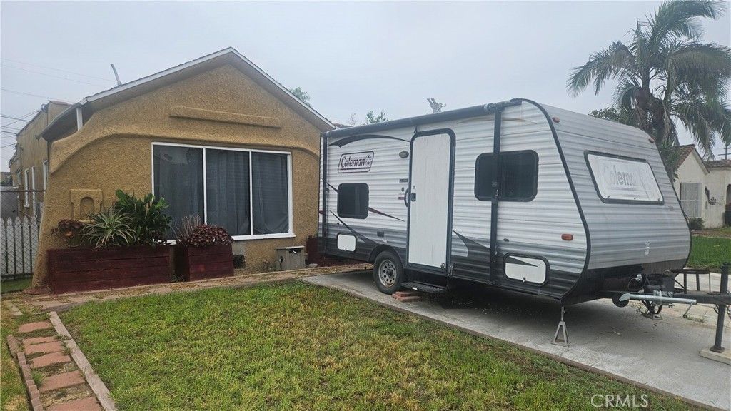 Photo of 739 W 102nd St, Los Angeles, CA 90044 (MLS # SR25220777)