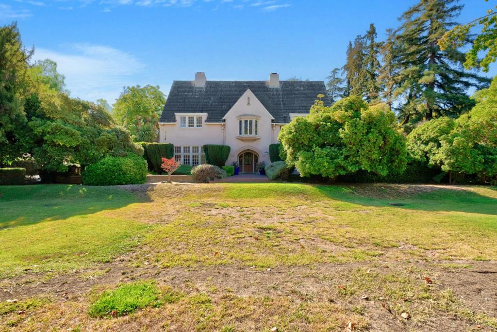 A once-in-a-lifetime opportunity to own one of the Rose Gardens most distinguished estates. On a commanding 1.155 acre parcel (the largest residential lot in the Rose Garden) stands the historic Wilder-Hait Mansion. This Modern English Tudor Revival is awe-inspiring in both scale and detail. From the steeply pitched gables & decorative half-timbering to the tall, grouped windows & arched entry, every element evokes the timeless elegance of its English roots. Diamond-pane leaded glass, ornate scuppers, multi-lite casements w/iron hinges & integral stucco fencing w/stone valls all reflect a craftsmanship and artistry rarely seen today. The estate flows seamlessly into lush, landscaped grounds. Towering redwoods frame sweeping lawns, courtyards, a sparkling pool and cabana. The setting is nothing short of extraordinary. An entertainers paradise, perfectly suited for grand celebrations, philanthropic galas & twilight garden parties. This is not just a home. It's a piece of San Jose history. A grand estate awaiting those with vision, taste and an appreciation for the rarest opportunities. A chance to own a residence that is at once architecturally distinguished, socially significant and wholly irreplaceable. For those who dream in character and think in legacy... this is your moment.