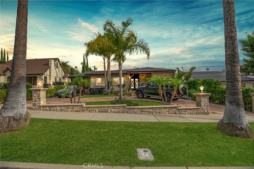 Glendale Gem North of Kenneth!

Welcome to this stunning Glendale retreat tucked along the palm tree–lined Western Avenue, neighboring from prestigious Brand Park. This home immediately impresses with its exquisite stonework, stamped concrete driveway, beautiful curb appeal, wrought-iron gate, and dual-pane windows. Enjoy relaxing on the spacious front patio before stepping through elegant double doors into a home filled with character and upgrades.

Inside, you’ll find gorgeous tile flooring, high ceilings with original exposed wood beams, and a hand-built fireplace accented with mosaic stone and stained glass details. The open floor plan seamlessly connects living spaces, creating a perfect flow for entertaining.

The chef’s kitchen features an oversized island, granite countertops, tile backsplash, double built-in refrigerators, and a freestanding stainless-steel range hood. Adjacent is the dining area overlooking the backyard and a second fireplace in the cozy informal living room.

Downstairs, a spacious basement offers two large rooms, a half bath, and a laundry area—ideal for storage, a home gym, or creative workspace.

All bathrooms have been recently remodeled with high-end materials and fixtures, adding a modern touch to this timeless home.

Step outside through double doors to your own private oasis featuring tile flooring, a custom-built BBQ station with stainless-steel appliances, a covered seating area with high ceilings, exposed wood beams, a large TV entertainment system, outdoor heater, and automatic roller shades. The aqua-blue pool and spa complete this entertainer’s paradise.

The converted garage offers incredible flexibility with custom cabinetry, tile flooring, a full bathroom, and a kitchenette—perfect for guests or a studio setup.

Don’t miss your chance to own this beautiful Glendale gem that blends charm, craftsmanship, and modern luxury—all just moments from Brand Park!