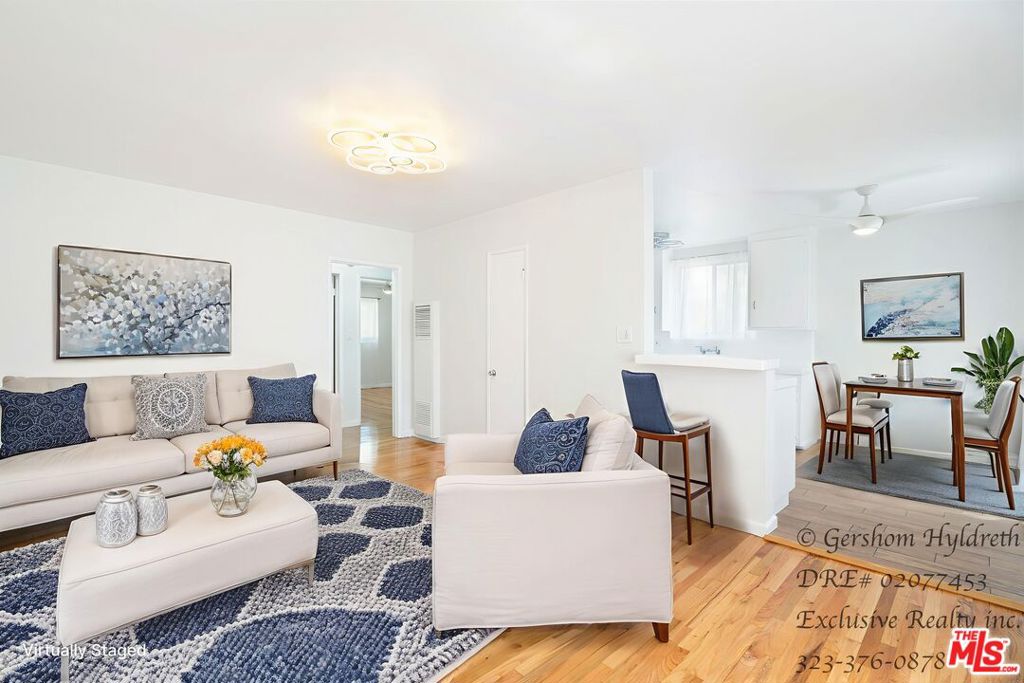 Modern Upper-Level 2BR Open Layout, Tons of Light, Move-In Ready! Spacious Upper 2nd Floor 2-Bedroom Apartment Move-In Ready! Live in comfort and style in this bright, open-concept 2-bedroom apartment featuring real wood and tile floors throughout. Perfect for entertaining or relaxing, the kitchen includes a stool-accessible counter, reglazed countertops, refrigerator, and stove. Sunlight pours in from large windows, highlighting modern lighting fixtures and creating an airy, inviting atmosphere.Apartment Features: Open-concept living and kitchen layout with ample natural light. Real wood and tile flooring throughout for easy maintenance. Brand new ductless mini-split AC & heater for year-round comfort. Spacious bathroom with pedestal sink and bonus storage cabinet. Large closets in both bedrooms for plenty of storage. Community laundry room with coin or coin-less options. 1 parking space with potential to fit 2 cars plus extra outdoor storage. Nearby Lifestyle & Attractions: This home offers more than just an apartment it's a lifestyle. Located in a vibrant neighborhood, you're just minutes from local shops, cafes, and markets, perfect for quick errands or casual dining. Enjoy outdoor recreation with nearby parks and hiking trails, or explore cultural and entertainment spots like theaters, galleries, and live music venues. Quick access to major transit routes makes commuting or exploring Los Angeles easy, while the quiet, residential setting ensures peace and privacy. Experience convenience, comfort, and the perfect mix of city energy and residential calm. Ready to move in now! VIRTUAL WALK-THROUGH